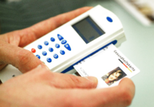 An electronic health card is put into a card reader