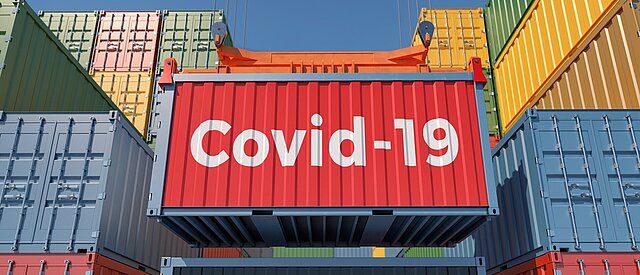 Schiffscontainer mit Covid-19 Aufdruck