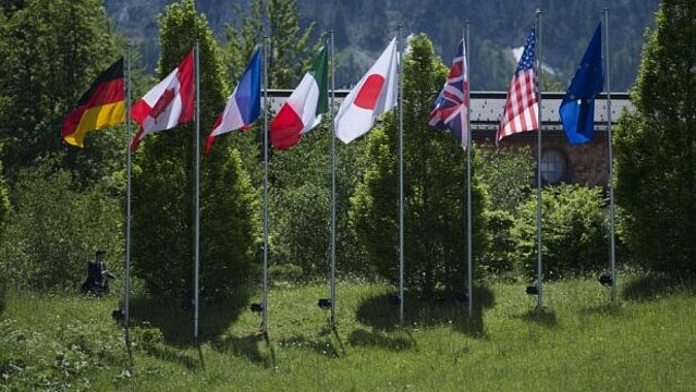 Photo: The flags of the G7 members and the European Union in front of "Schloss Elmau"