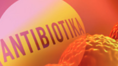 orangene Kugeln mit Schriftzug "Antibiotika" (Nahaufnahme)