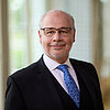Portraitfoto im Querformat vom Parlamentarischen Staatssekretär Dr. Georg Kippels