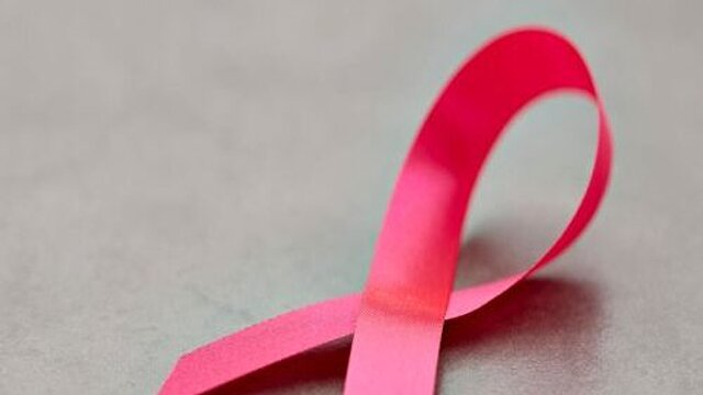 Close-Up Of Aids Awareness Ribbon On Table